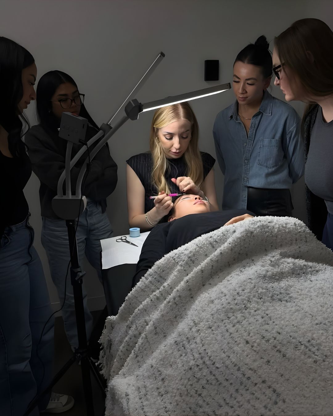 Hands-on lash education in progress at District Studios